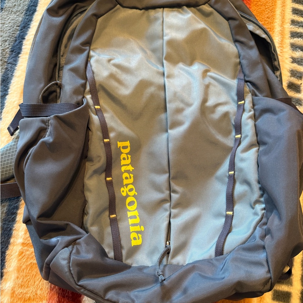 Patagonia Blue Backpack with Yellow Logo Accent